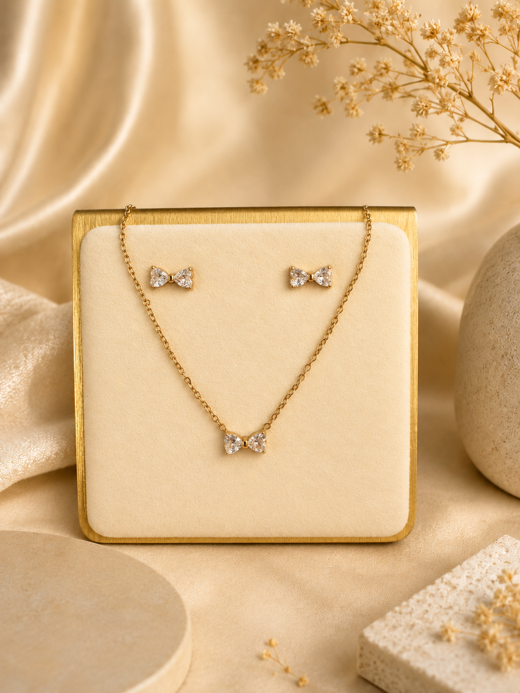 Crystal bow necklace and earring set on display