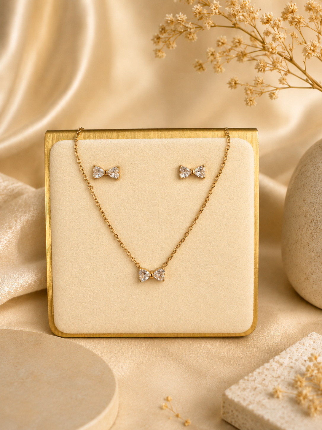 Crystal bow necklace and earring set on display