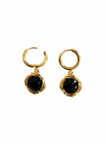 Round black drop earrings with sculptural gold-tone frames and hoops on a white background